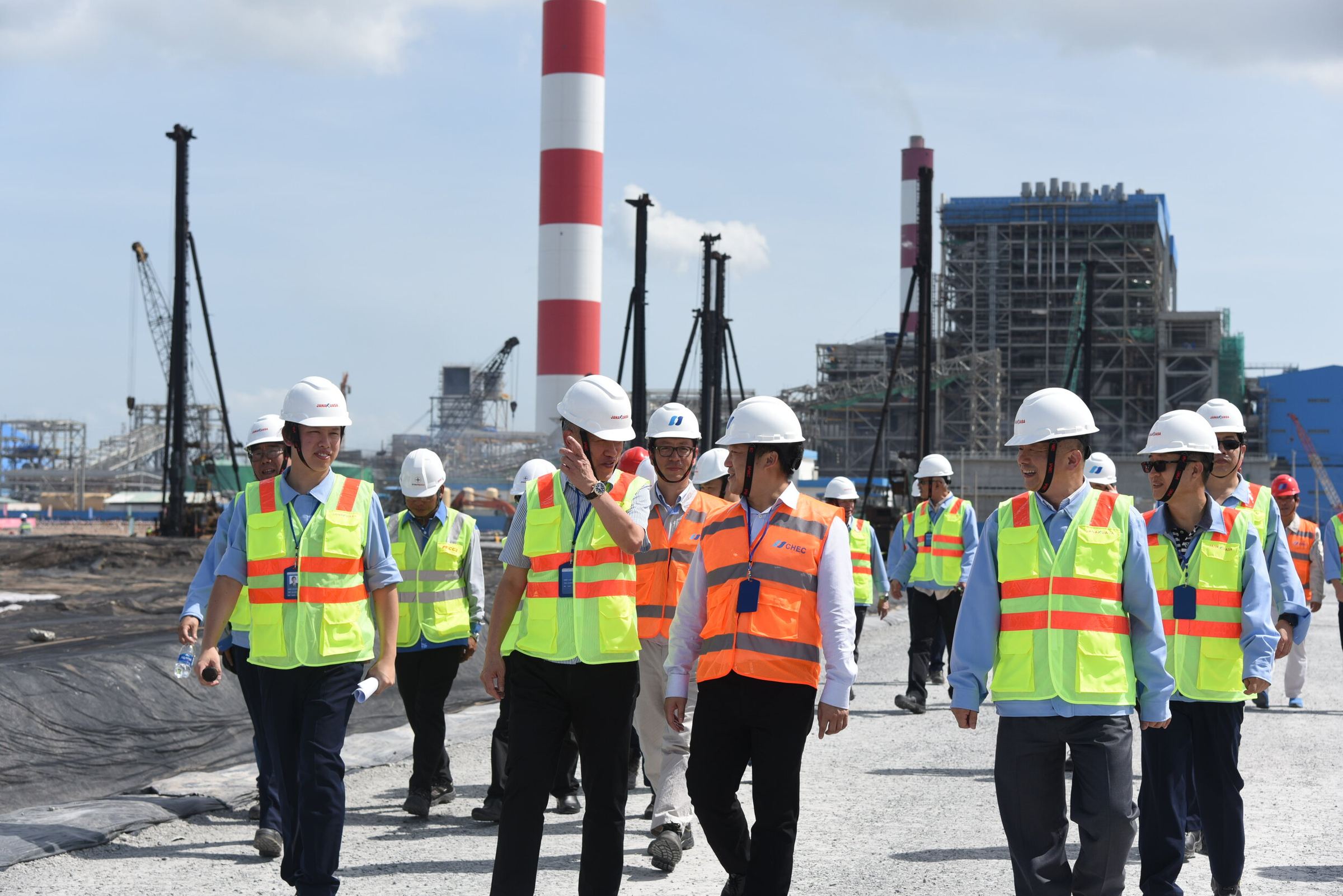 Janakuasa engineers walking the Duyen Hai 2 construction site